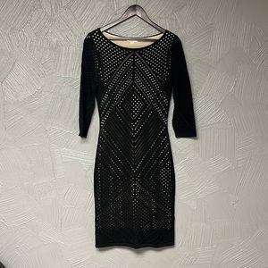 Calvin Klein black body con dress with see through styling, nude underskirt.